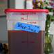 Tub of beef juice on counter